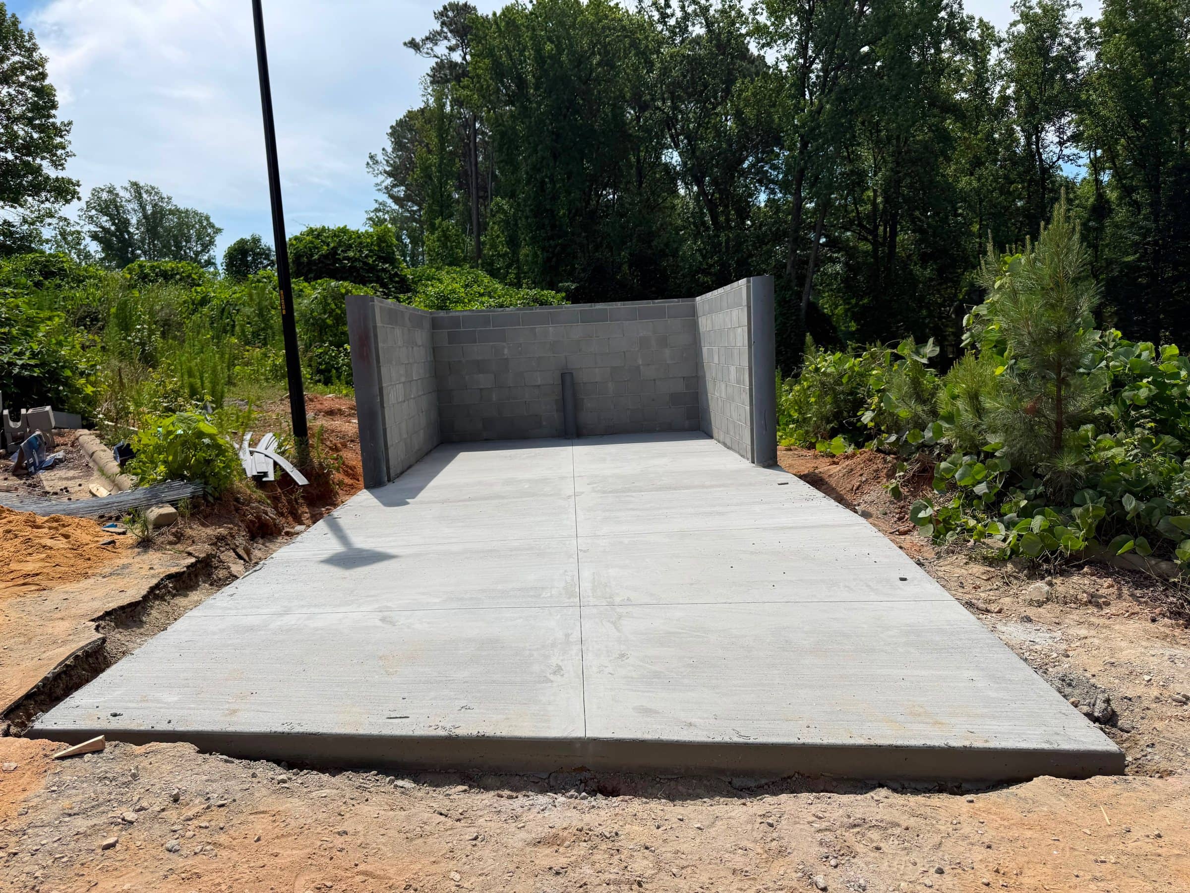 Finished concrete garage slab inside block walls